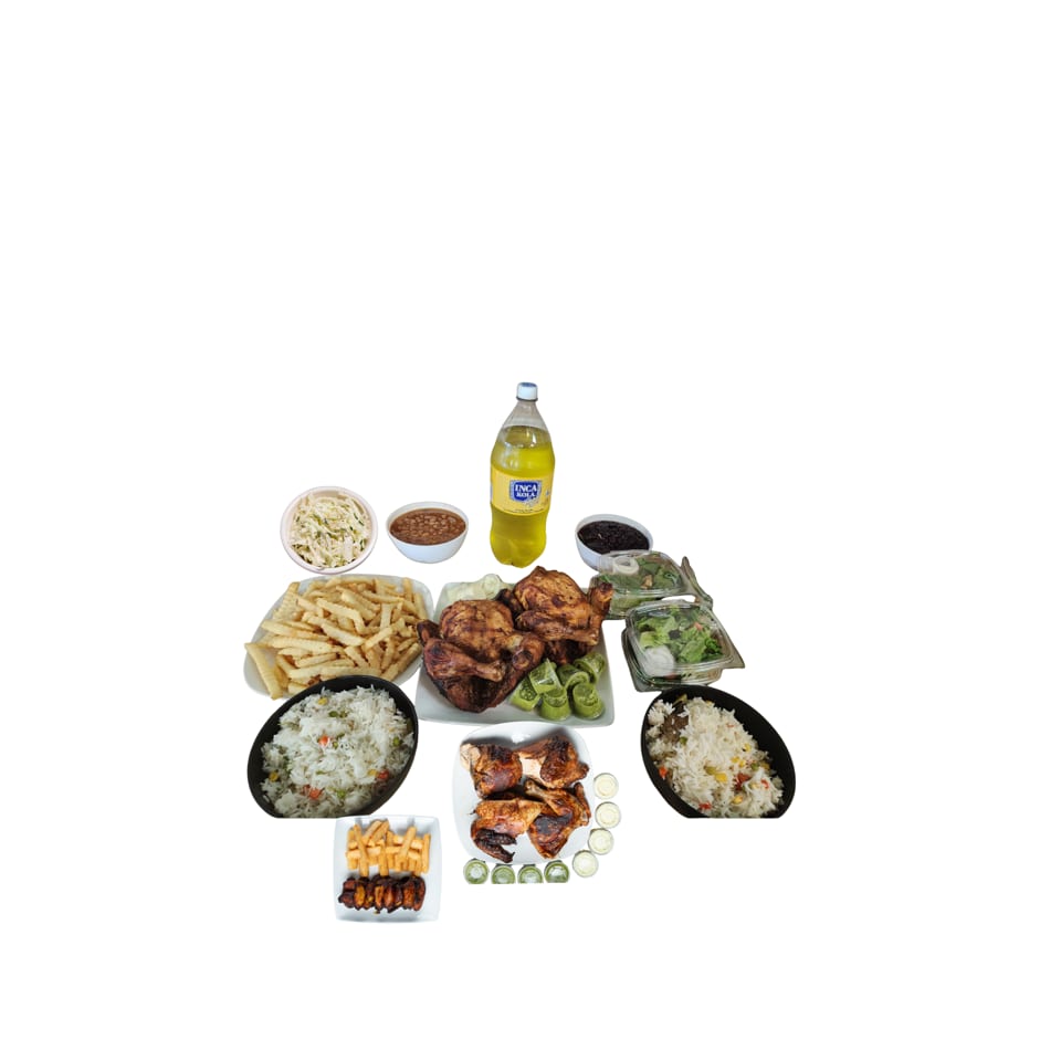 A large family meal with whole roasted chickens, fries, rice, salads, beans, and a bottle of Inca Kola.